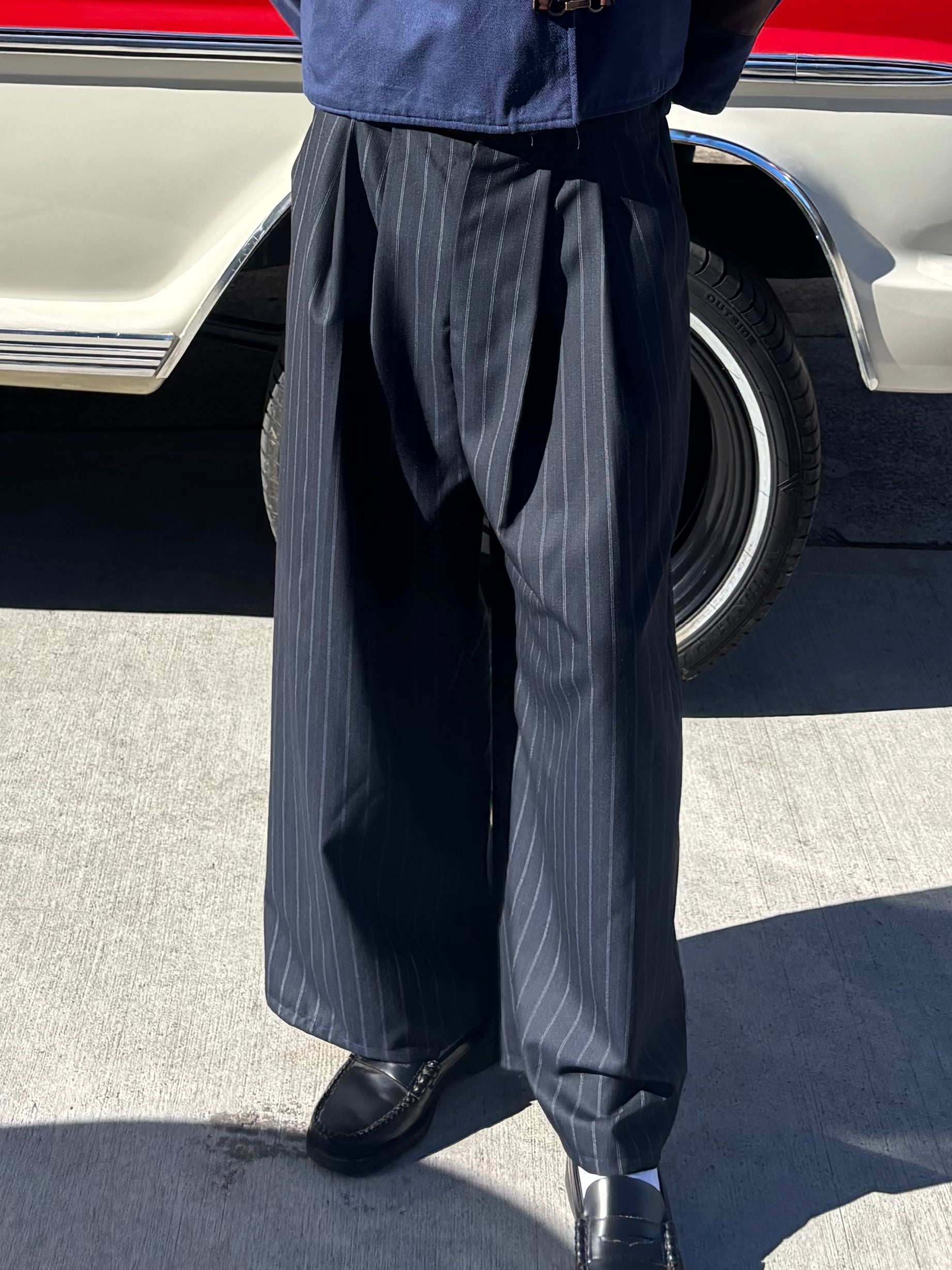 PINSTRIPE PLEATED NAVY PANTS